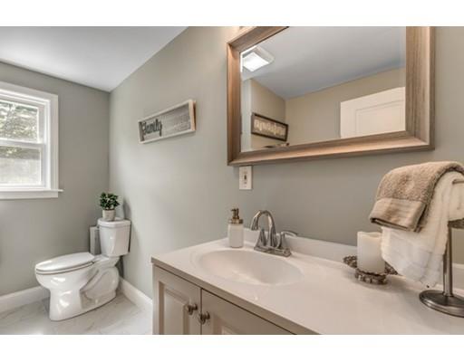 55 Cottage Road Boston, MA 02132 - Photo 15 of 30 a bathroom with a sink toilet and a mirror