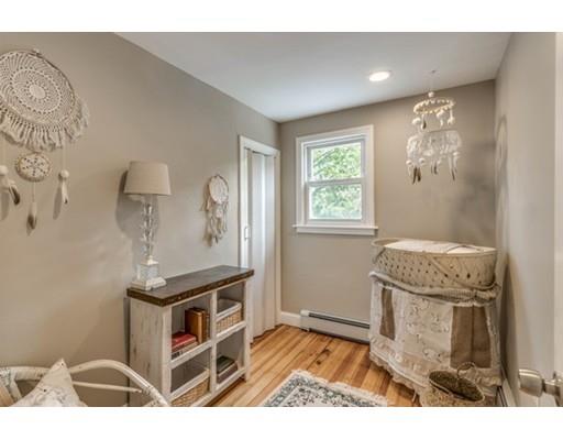 55 Cottage Road Boston, MA 02132 - Photo 17 of 30 a living room with furniture and a window