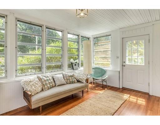 55 Cottage Road Boston, MA 02132 - Photo 19 of 30 a living room with furniture and large windows