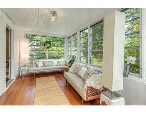 55 Cottage Road Boston, MA 02132 - Photo 20 of 30 a living room with furniture and a large window