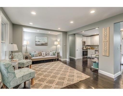 55 Cottage Road Boston, MA 02132 - Photo 2 of 30 a living room with furniture and a wooden floor
