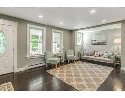 55 Cottage Road Boston, MA 02132 - Photo 3 of 30 a living room with furniture and a large window