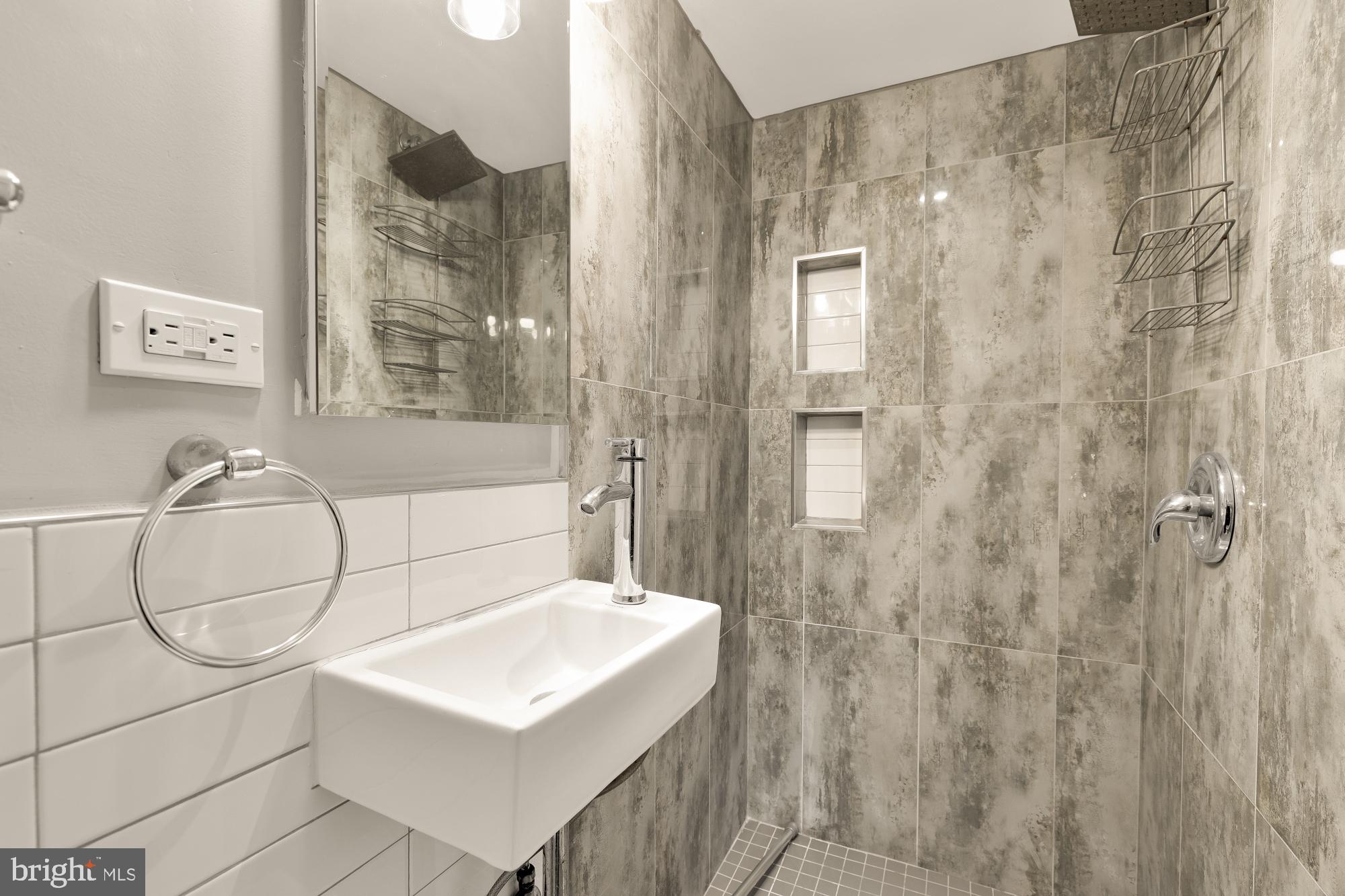 1732 North Capitol Street Northwest Washington, DC 20002 - Photo 13 of 47 a bathroom with a sink a toilet and shower