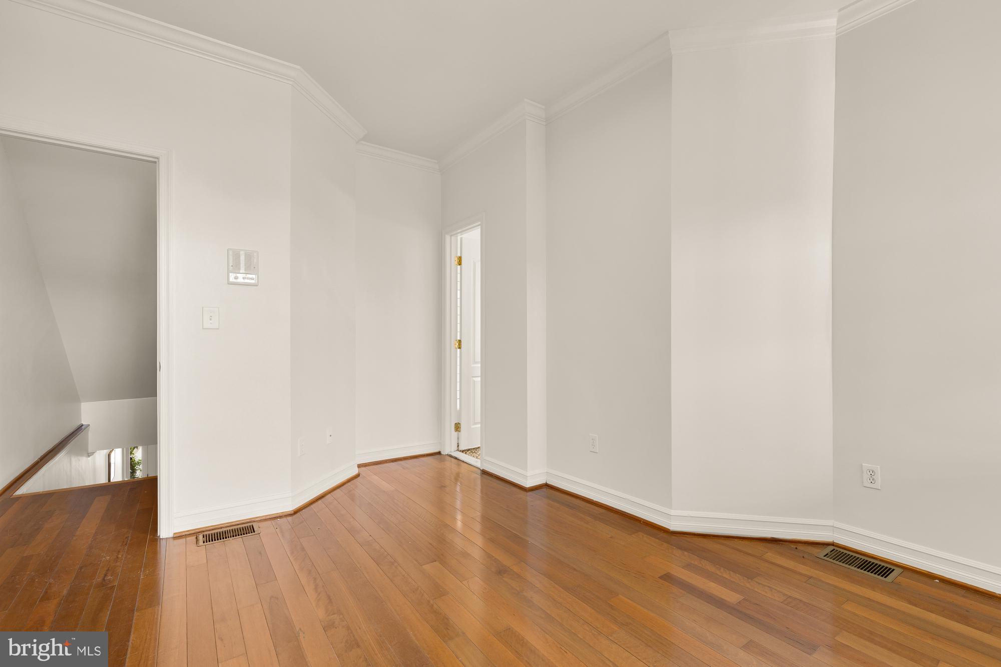 1732 North Capitol Street Northwest Washington, DC 20002 - Photo 15 of 47 a view of an empty room with wooden floor