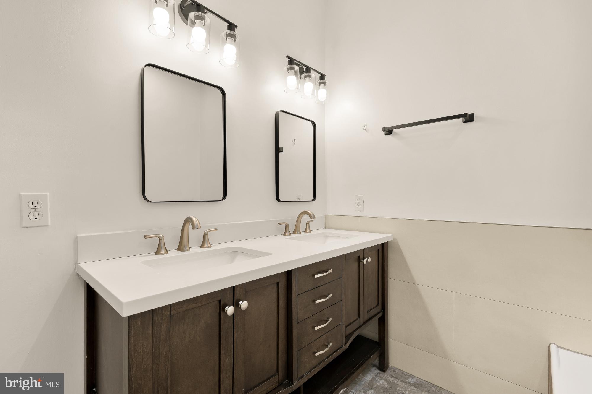 1732 North Capitol Street Northwest Washington, DC 20002 - Photo 23 of 47 a bathroom with a double vanity sink and mirror