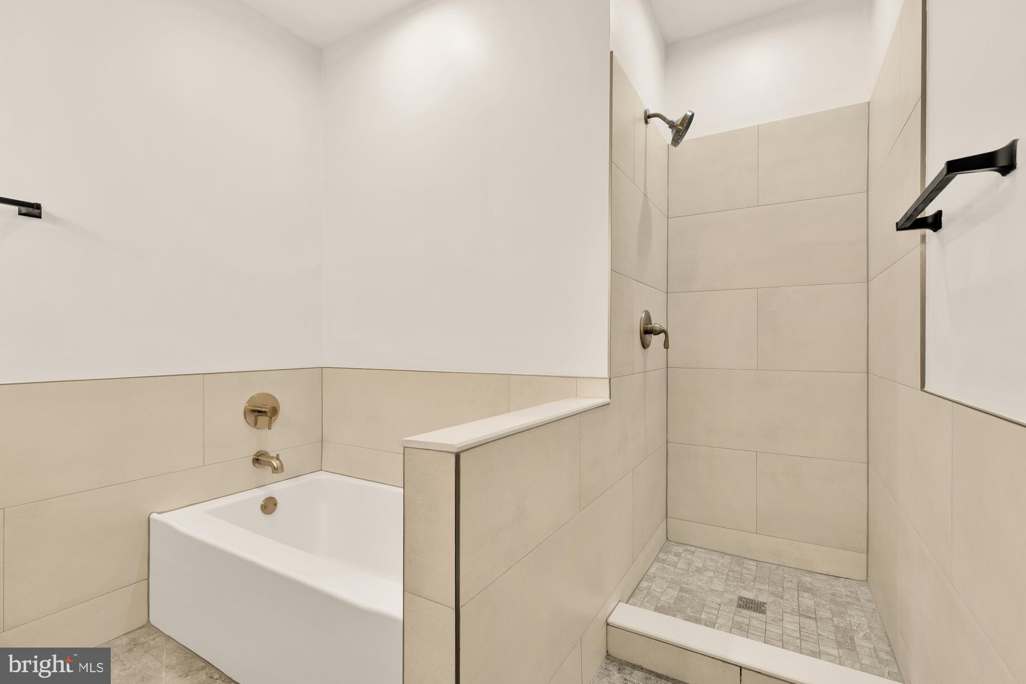 1732 North Capitol Street Northwest Washington, DC 20002 - Photo 24 of 47 a bathroom with a shower and mirror