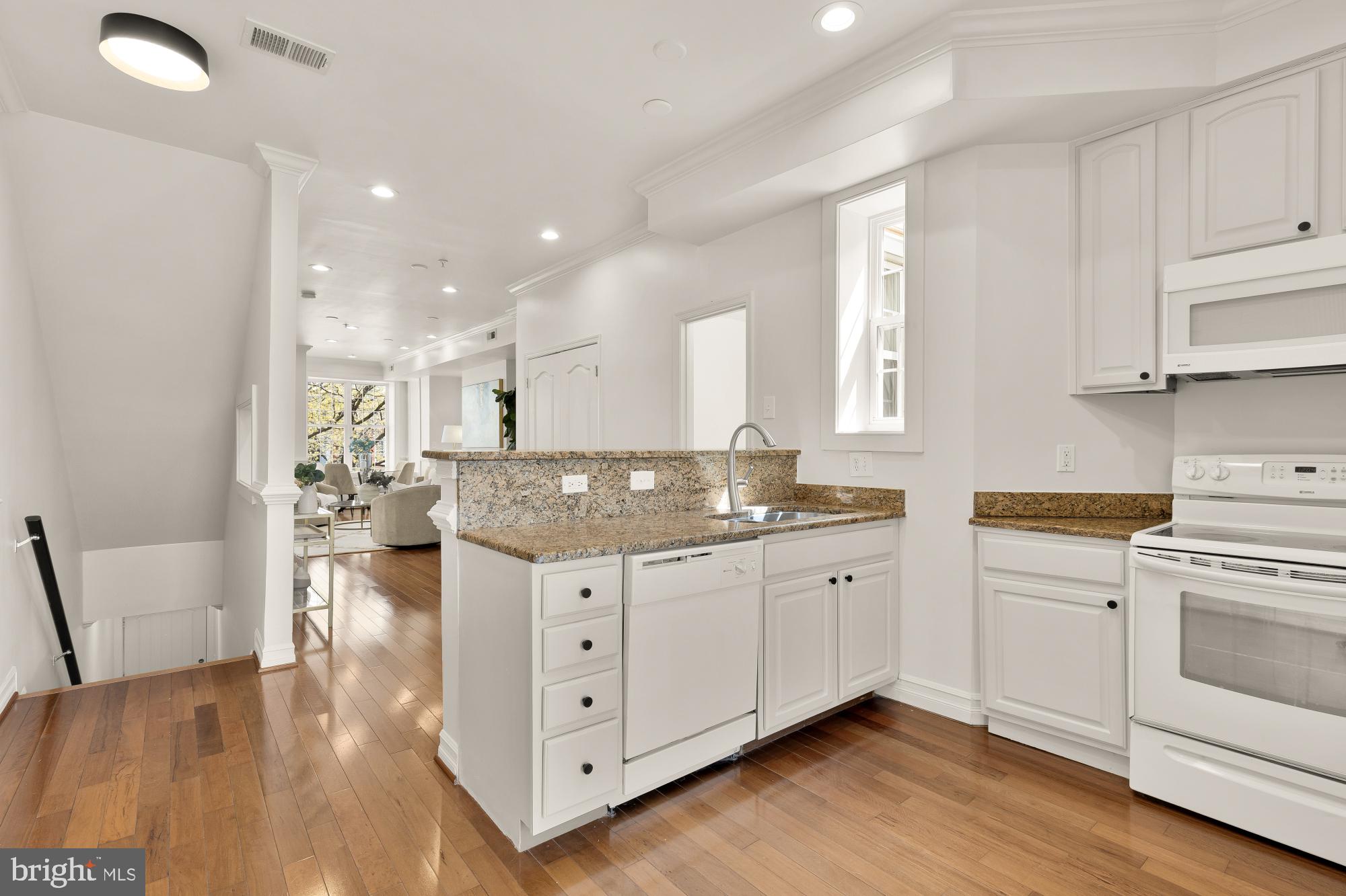 1732 North Capitol Street Northwest Washington, DC 20002 - Photo 28 of 47 a kitchen with white cabinets and sink