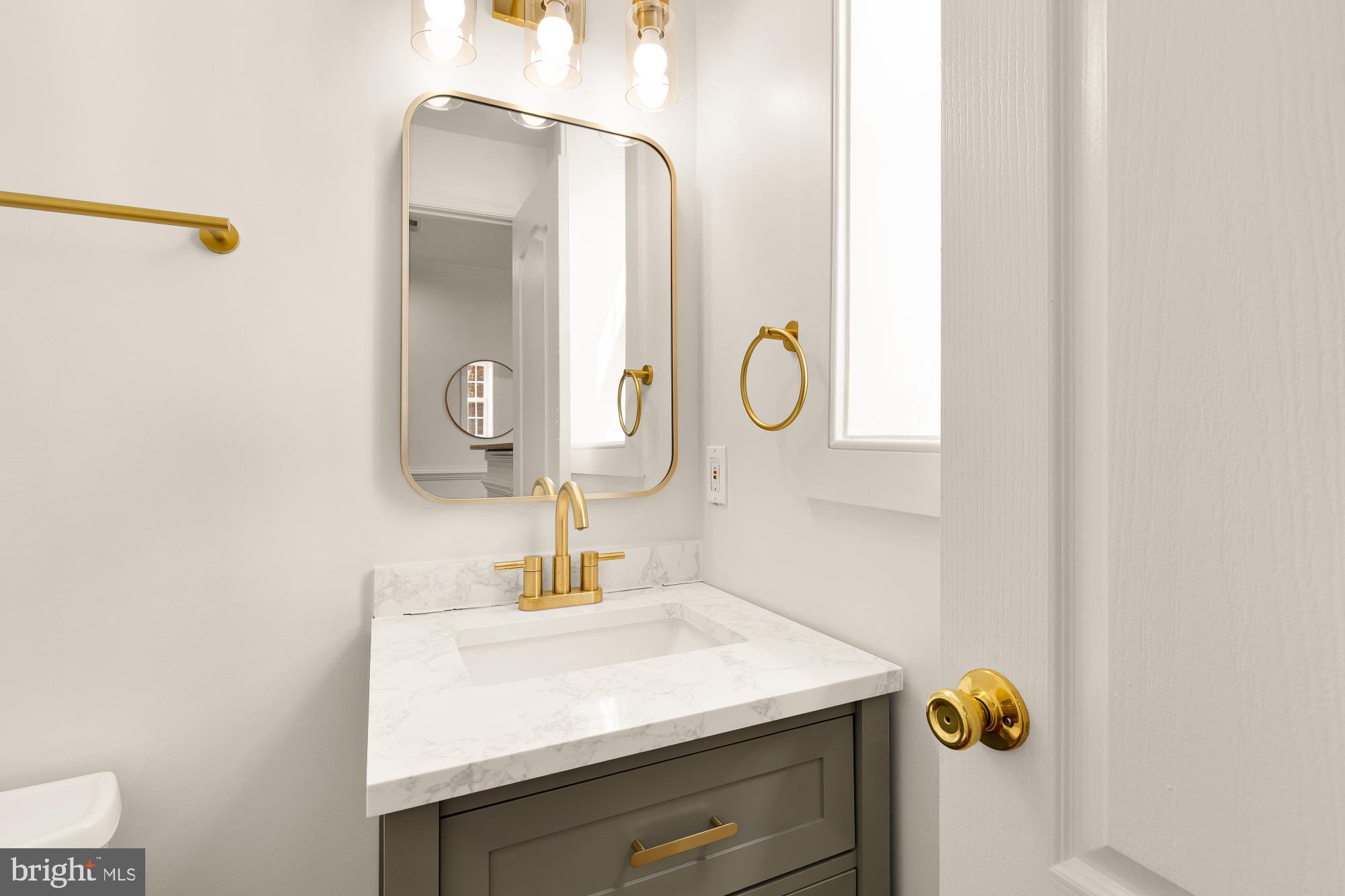 1732 North Capitol Street Northwest Washington, DC 20002 - Photo 30 of 47 a bathroom with a sink and a mirror