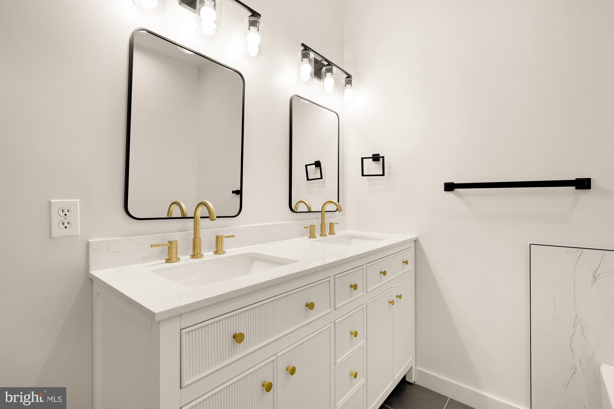 1732 North Capitol Street Northwest Washington, DC 20002 - Photo 42 of 47 a bathroom with a double vanity sink and mirror