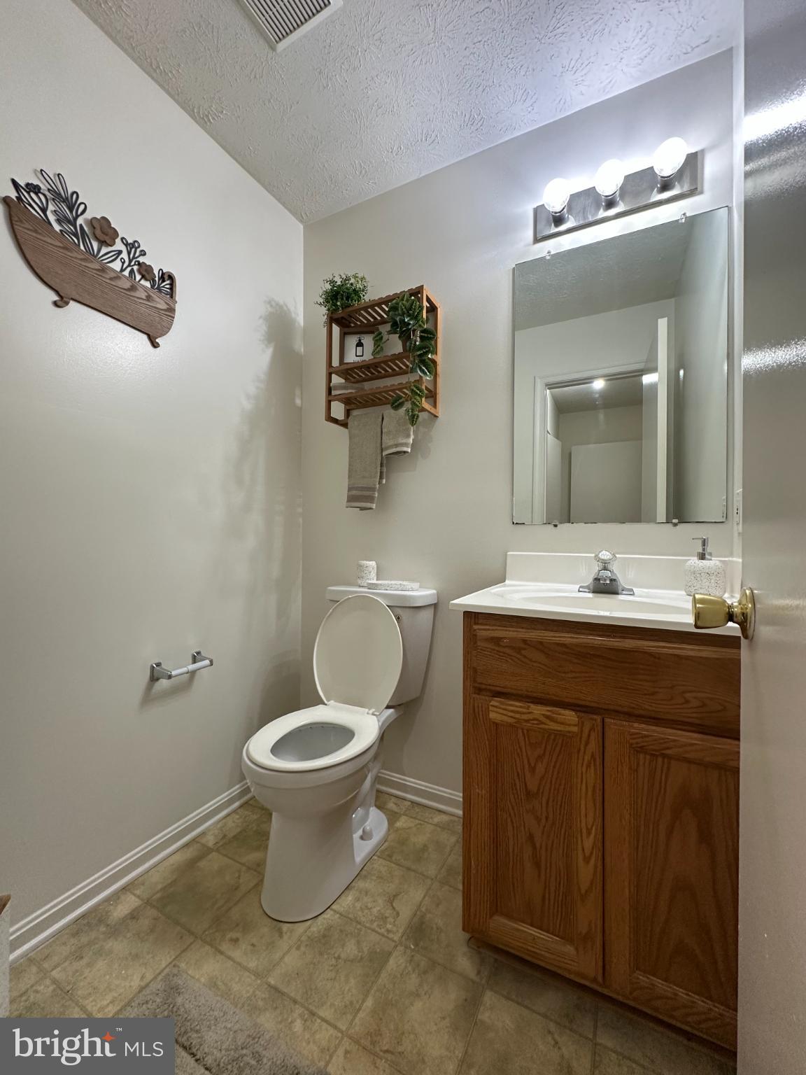 368 Center Deen Avenue Aberdeen, MD 21001 - Photo 3 of 10 a bathroom with a sink and a mirror