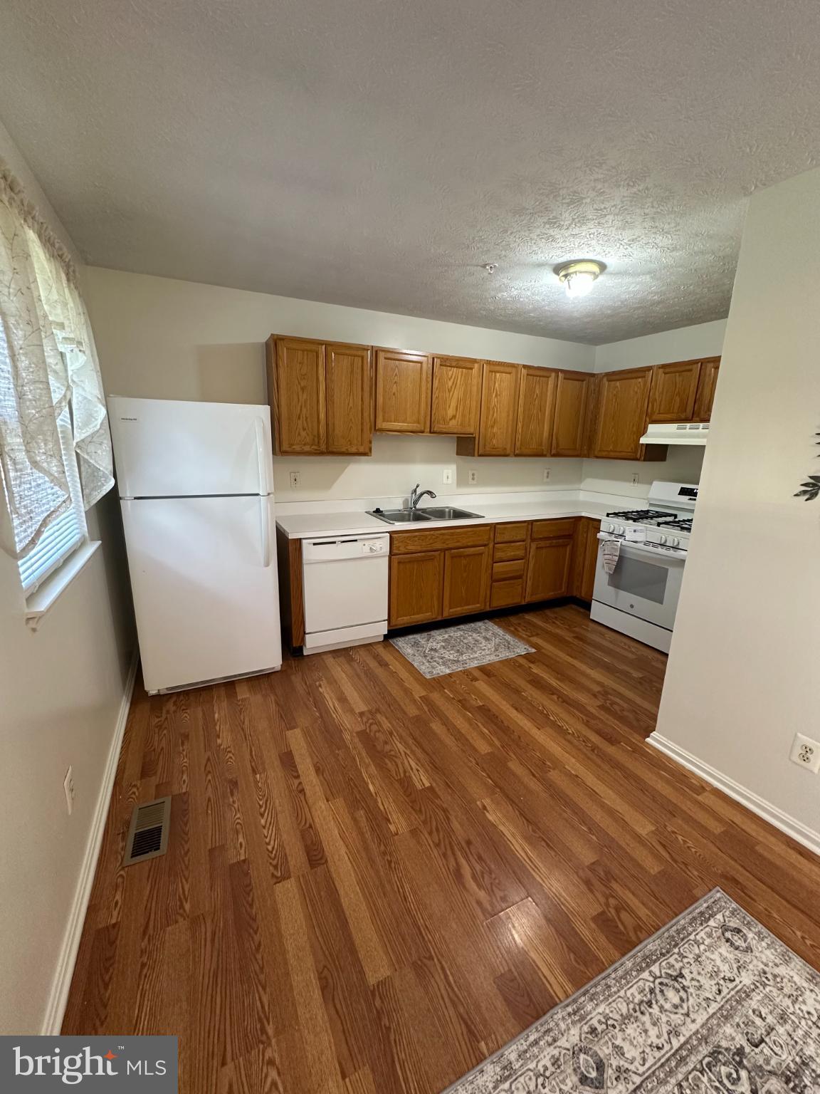 368 Center Deen Avenue Aberdeen, MD 21001 - Photo 4 of 10 a kitchen with a sink and wooden floor