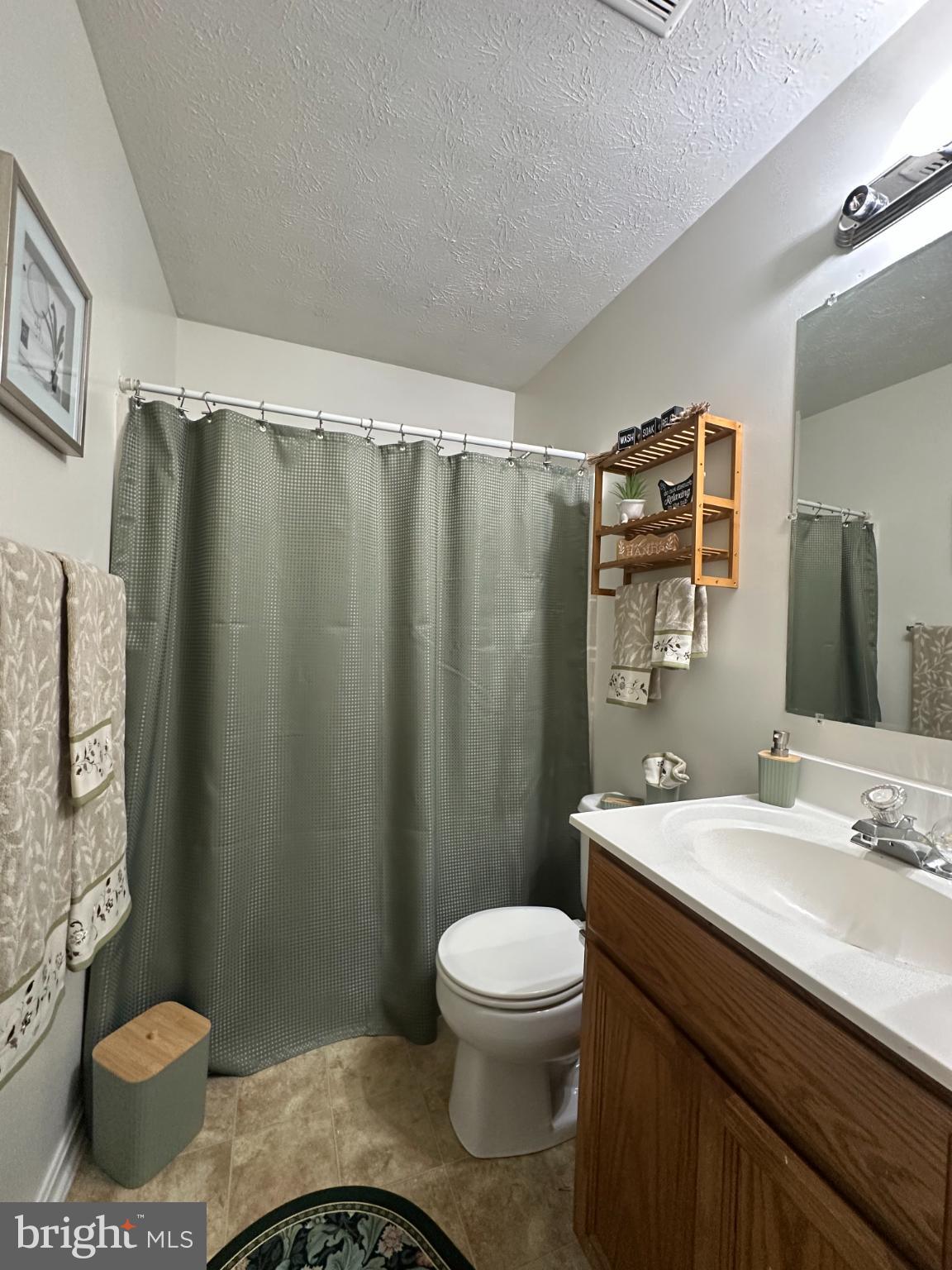 368 Center Deen Avenue Aberdeen, MD 21001 - Photo 10 of 10 a bathroom with a sink a toilet and shower