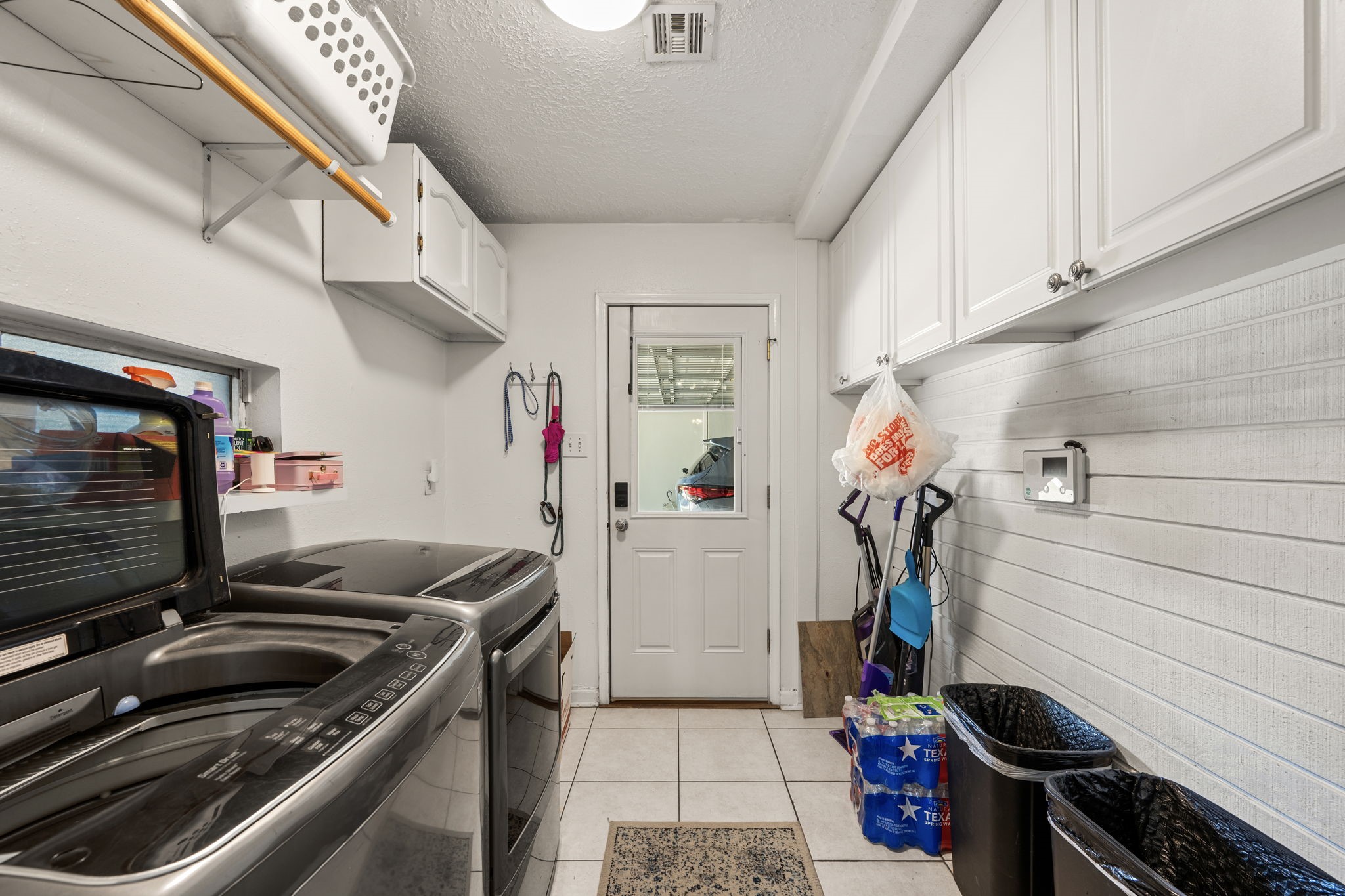2415 Whispering Springs Drive Spring, TX 77373 - Photo 24 of 28 Utility room offers hanging space and additional storage.