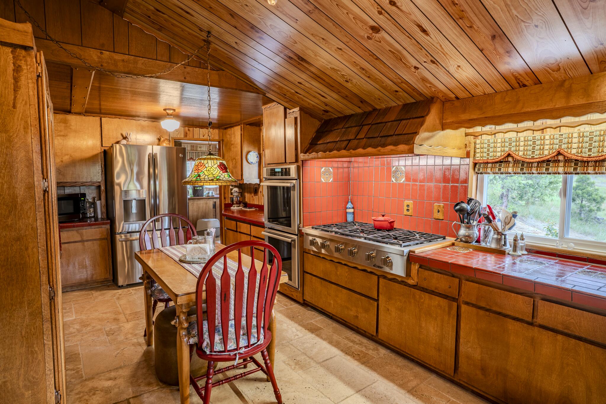 1969 Colestin Road Ashland, OR 97520 - Photo 31 of 72 a kitchen with stainless steel appliances granite countertop a sink and wooden cabinets