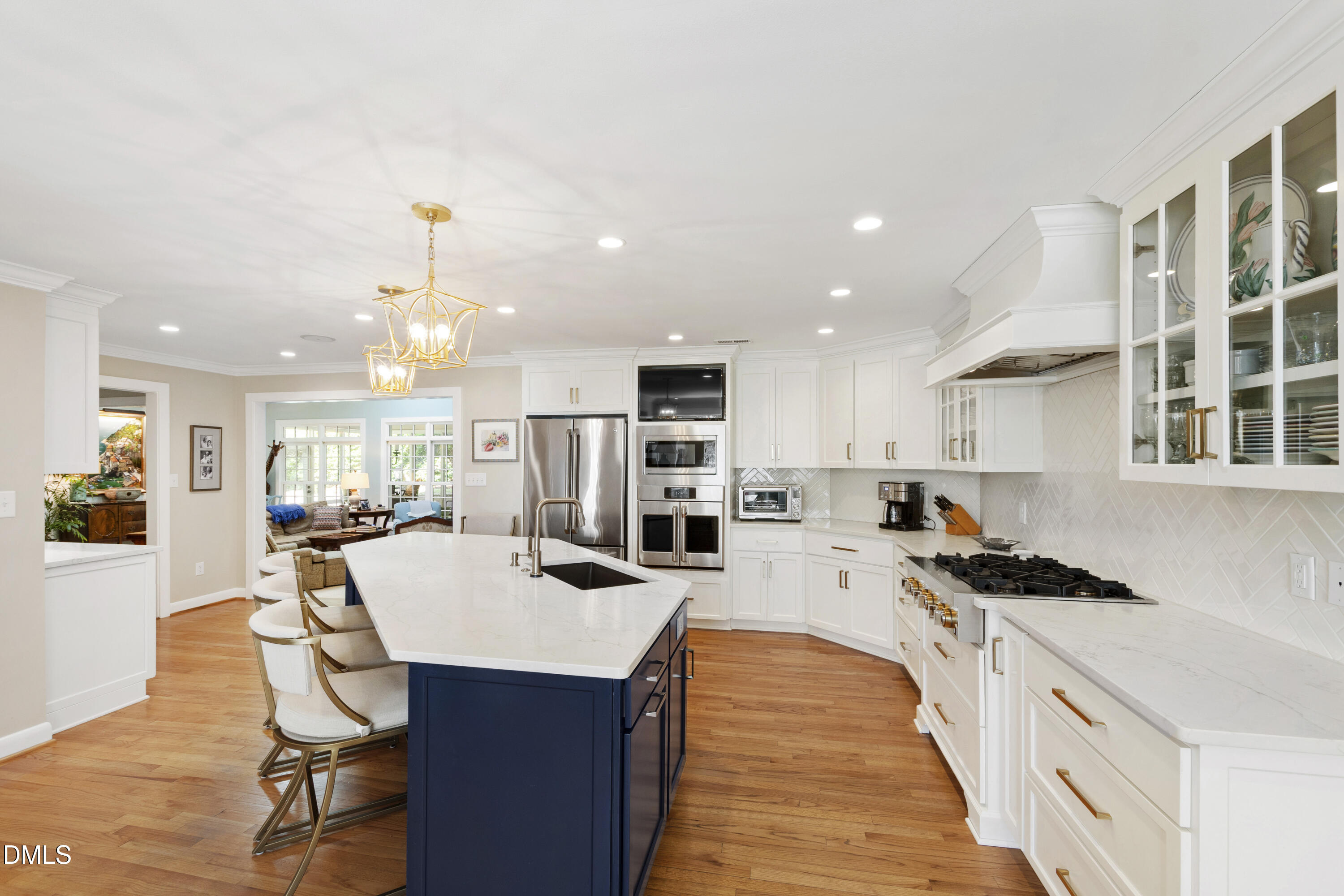 1304 Diehl Street Raleigh, NC 27608 - Photo 17 of 60 a kitchen with stainless steel appliances kitchen island granite countertop a sink and cabinets