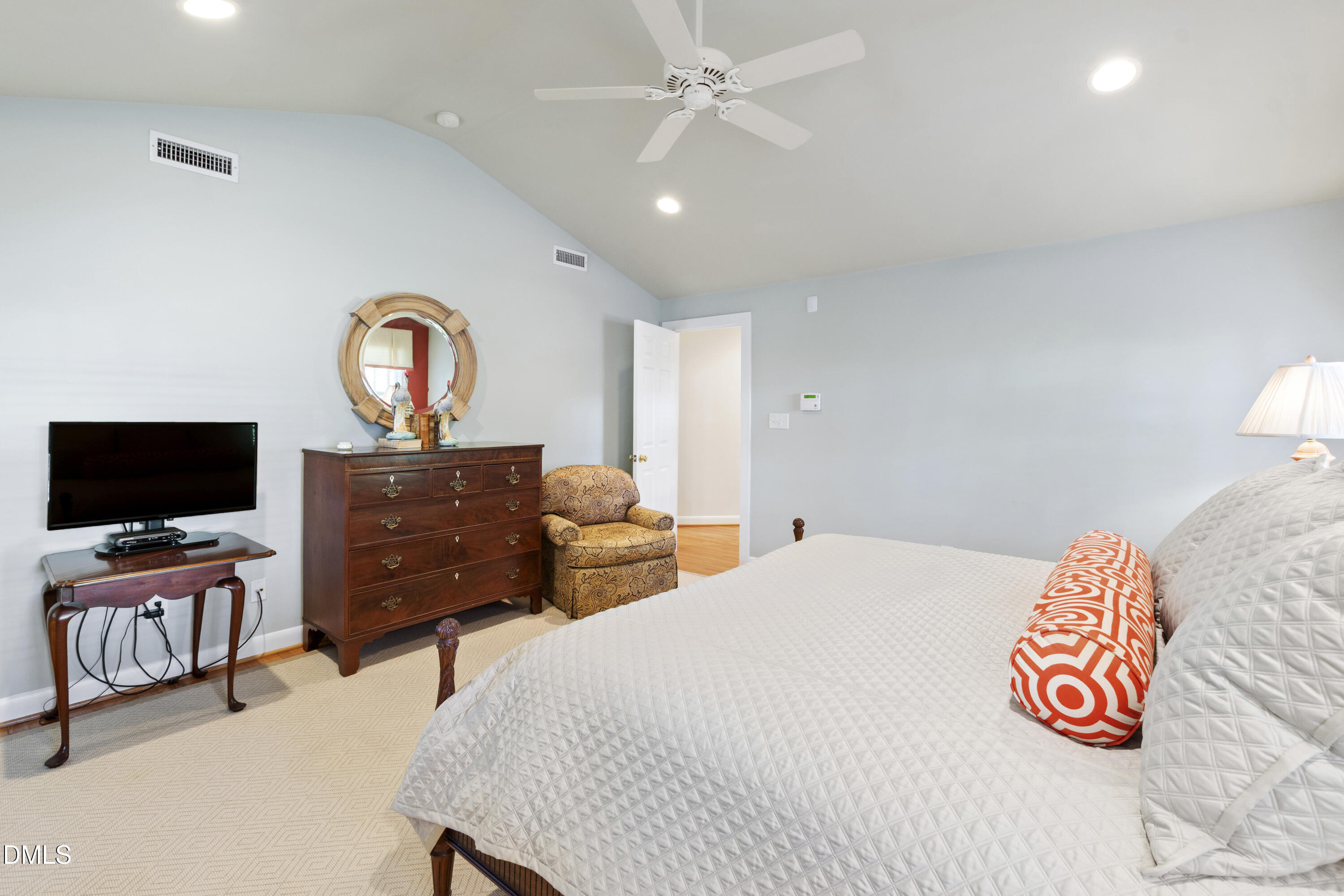 1304 Diehl Street Raleigh, NC 27608 - Photo 30 of 60 a bedroom with a bed and flat screen tv