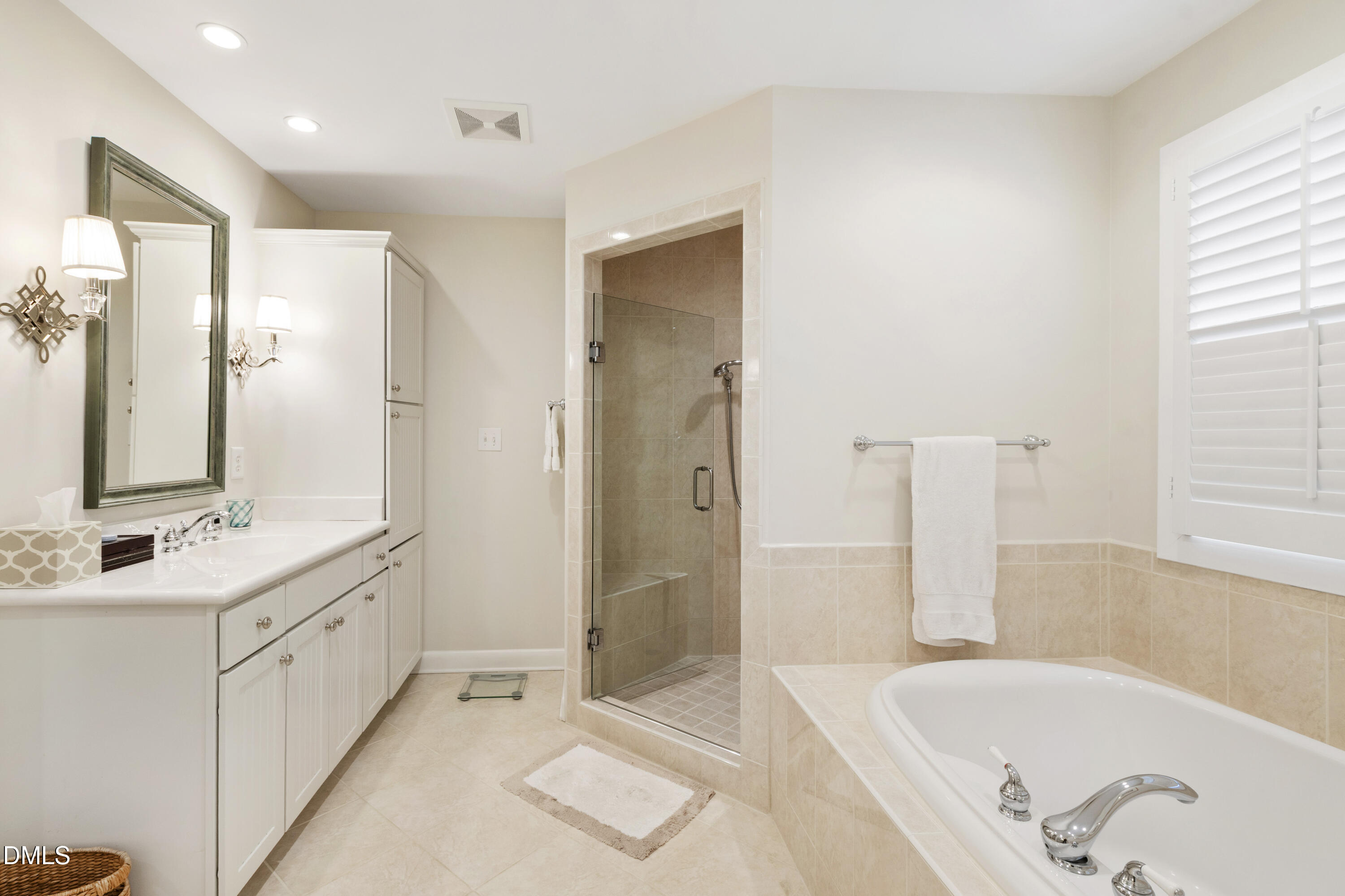 1304 Diehl Street Raleigh, NC 27608 - Photo 33 of 60 a bathroom with a tub sink and mirror