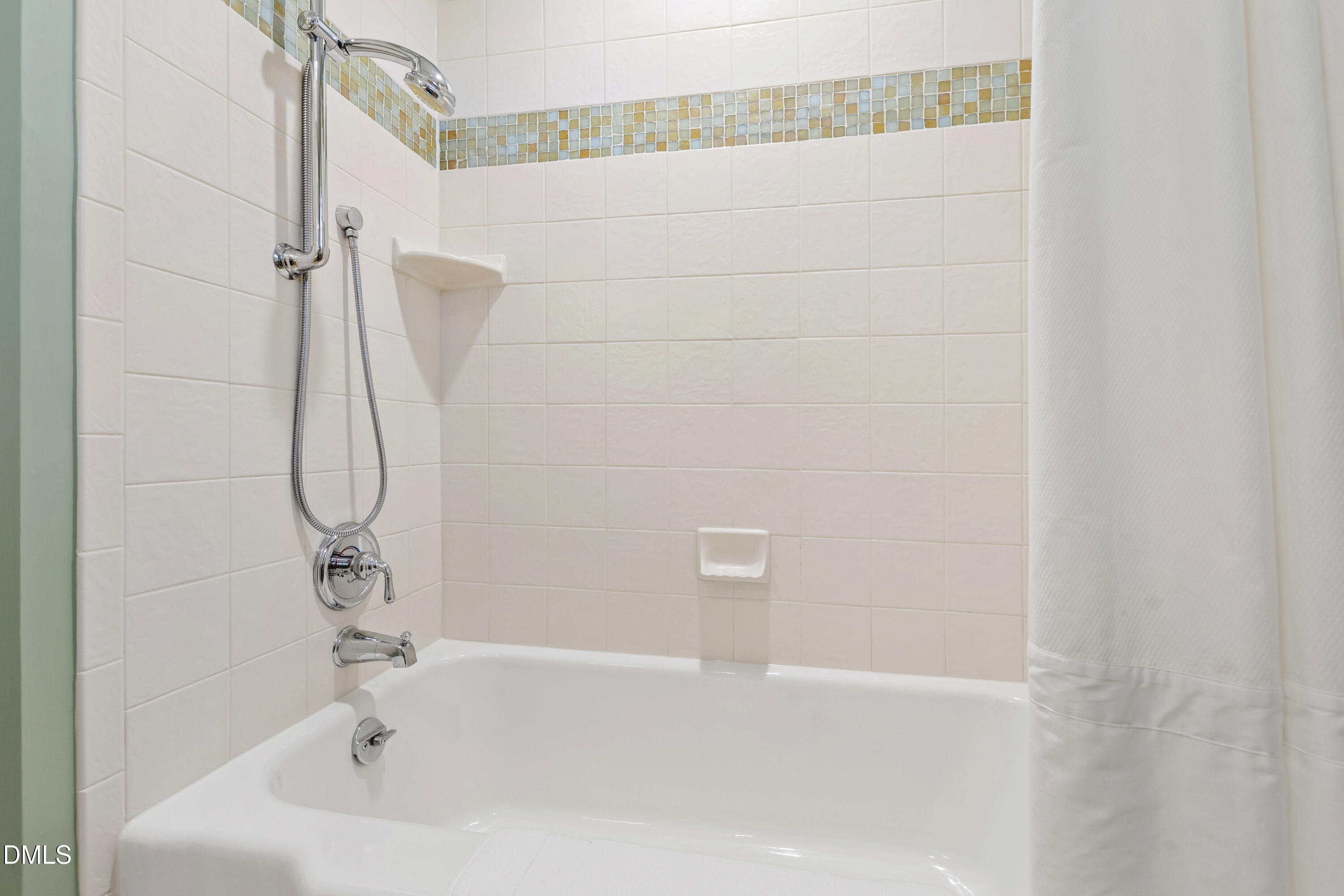 1304 Diehl Street Raleigh, NC 27608 - Photo 43 of 60 a bathroom with a white bath tub and a shower
