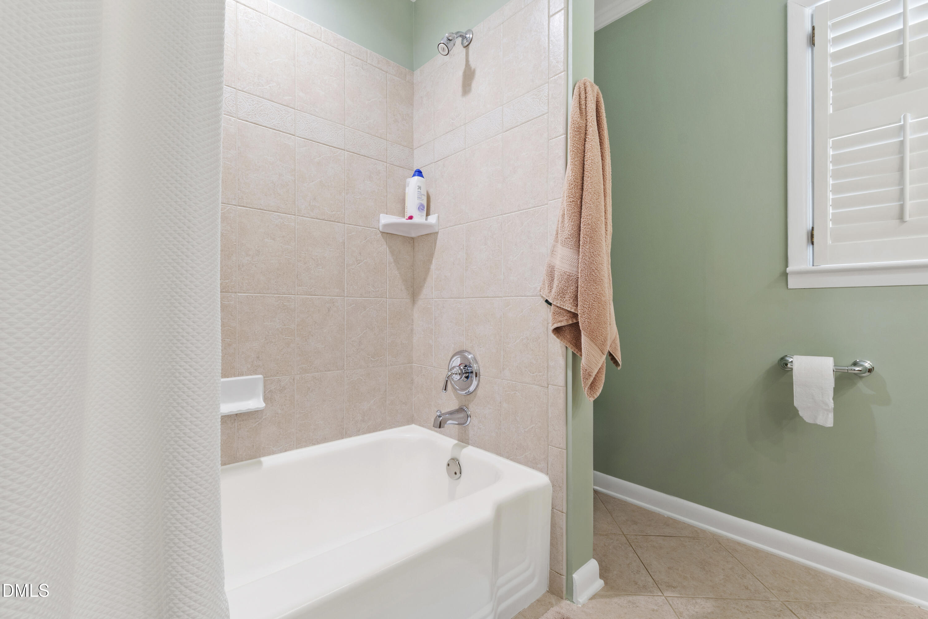 1304 Diehl Street Raleigh, NC 27608 - Photo 44 of 60 a bathroom with a white bath tub and a shower
