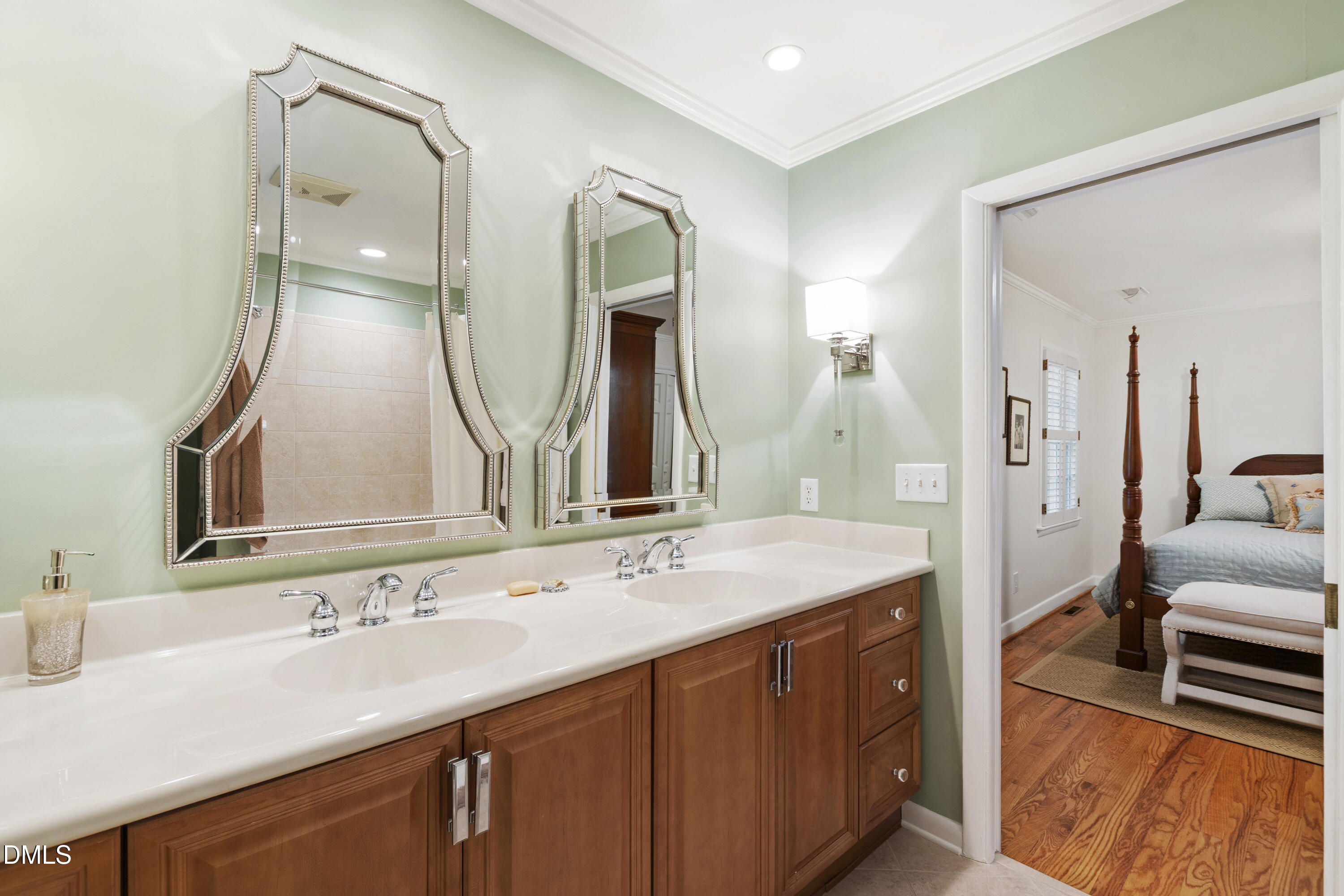 1304 Diehl Street Raleigh, NC 27608 - Photo 45 of 60 a spacious bathroom with a double vanity sink and a mirror