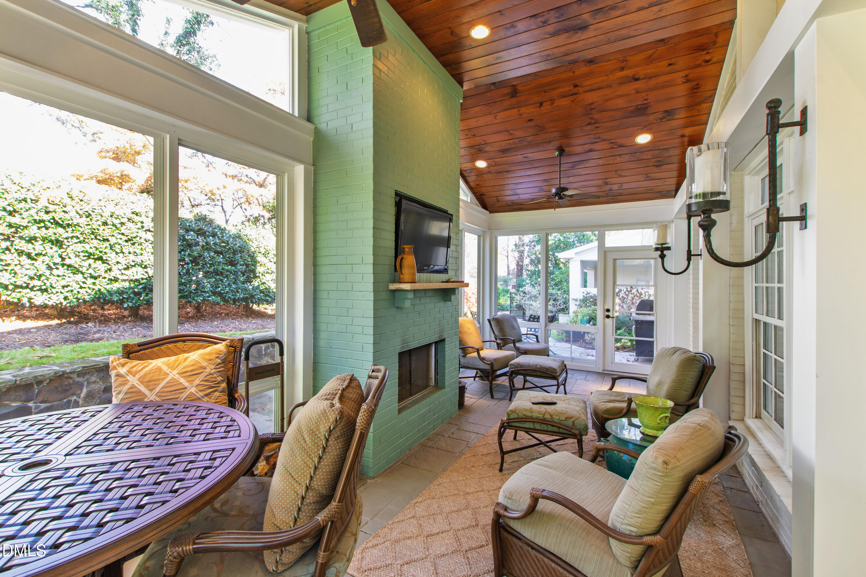 1304 Diehl Street Raleigh, NC 27608 - Photo 51 of 60 a living room with furniture and a floor to ceiling window