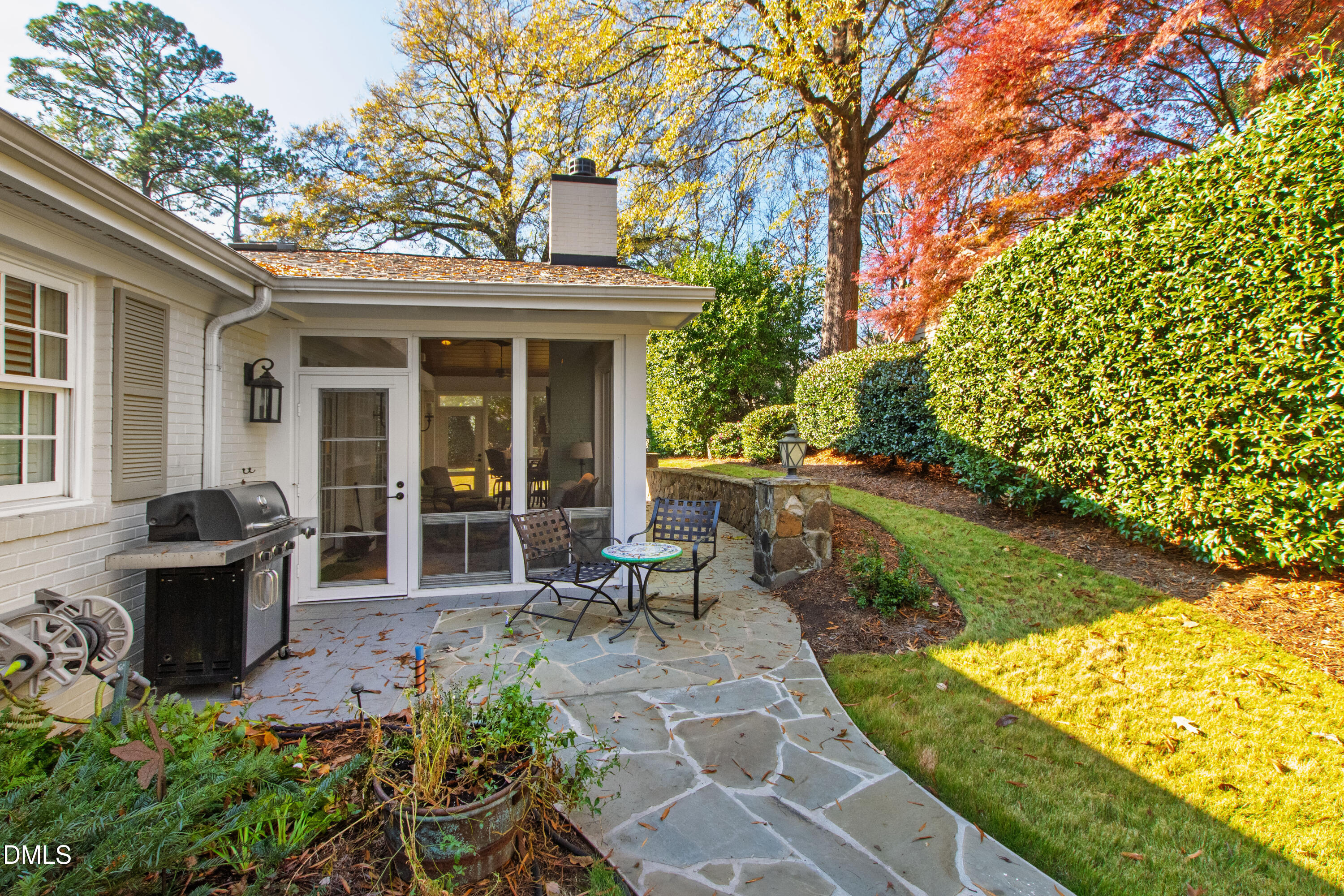1304 Diehl Street Raleigh, NC 27608 - Photo 57 of 60 a view of a house with backyard sitting area and garden