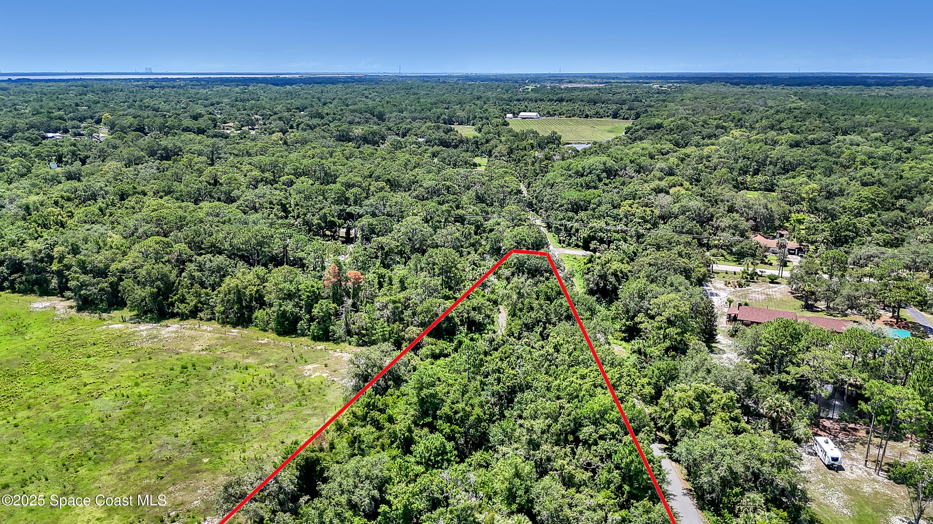 4300 Burkholm Road Mims, FL 32754 - Photo 11 of 15 a view of a lush green space with sea