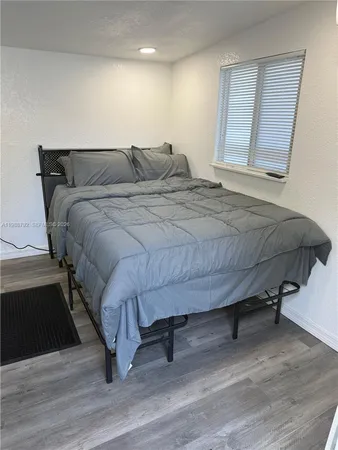 a kitchen with stainless steel appliances granite countertop a refrigerator sink and microwave