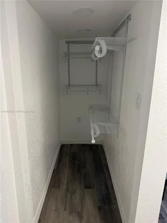 a bathroom with a sink a toilet a mirror and vanity