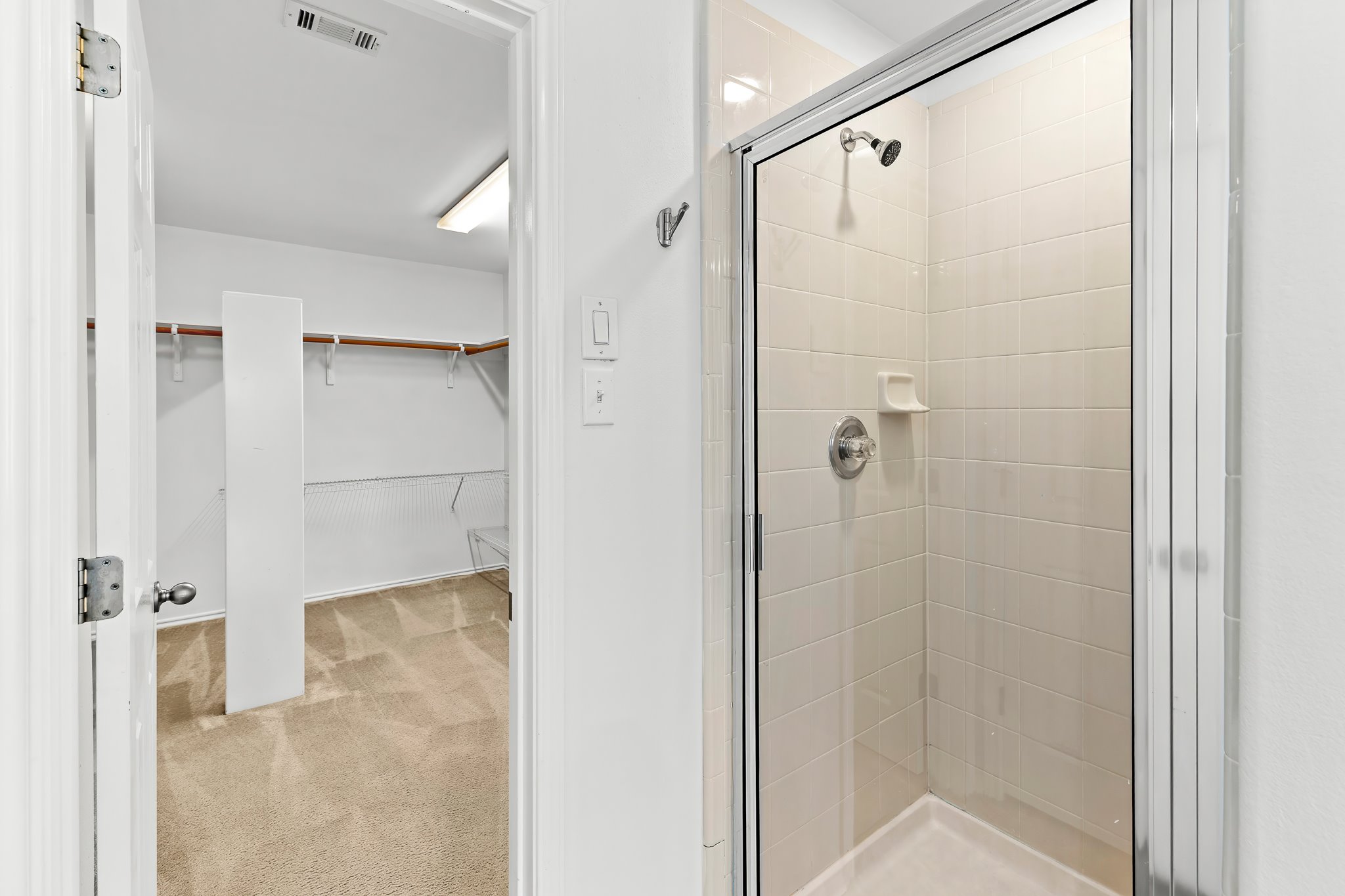 6700 Tulloch Way Austin, TX 78754 - Photo 30 of 39 a bathroom with a shower and a glass door