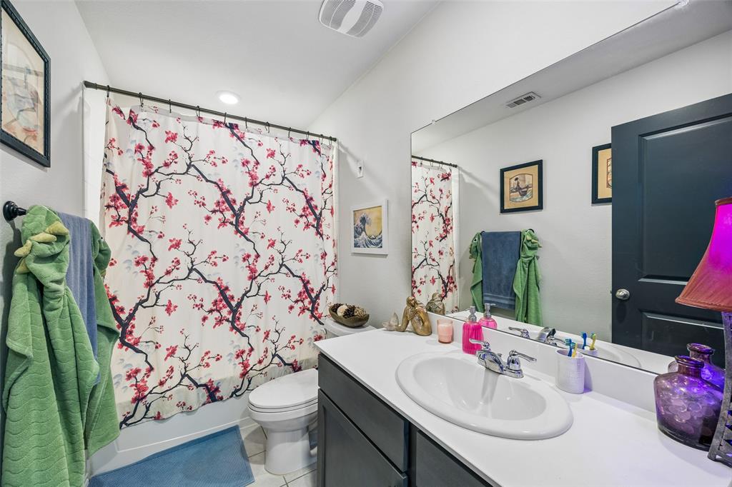 802 Rustic Way Royse City, TX 75189 - Photo 10 of 38 a bathroom with a sink toilet and shower curtain