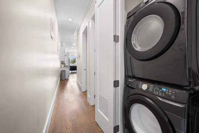 a view of a hallway with washer and dryer
