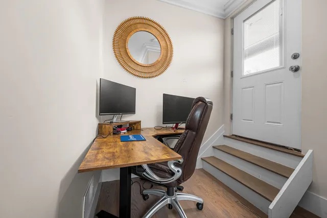 a view of a workspace with furniture