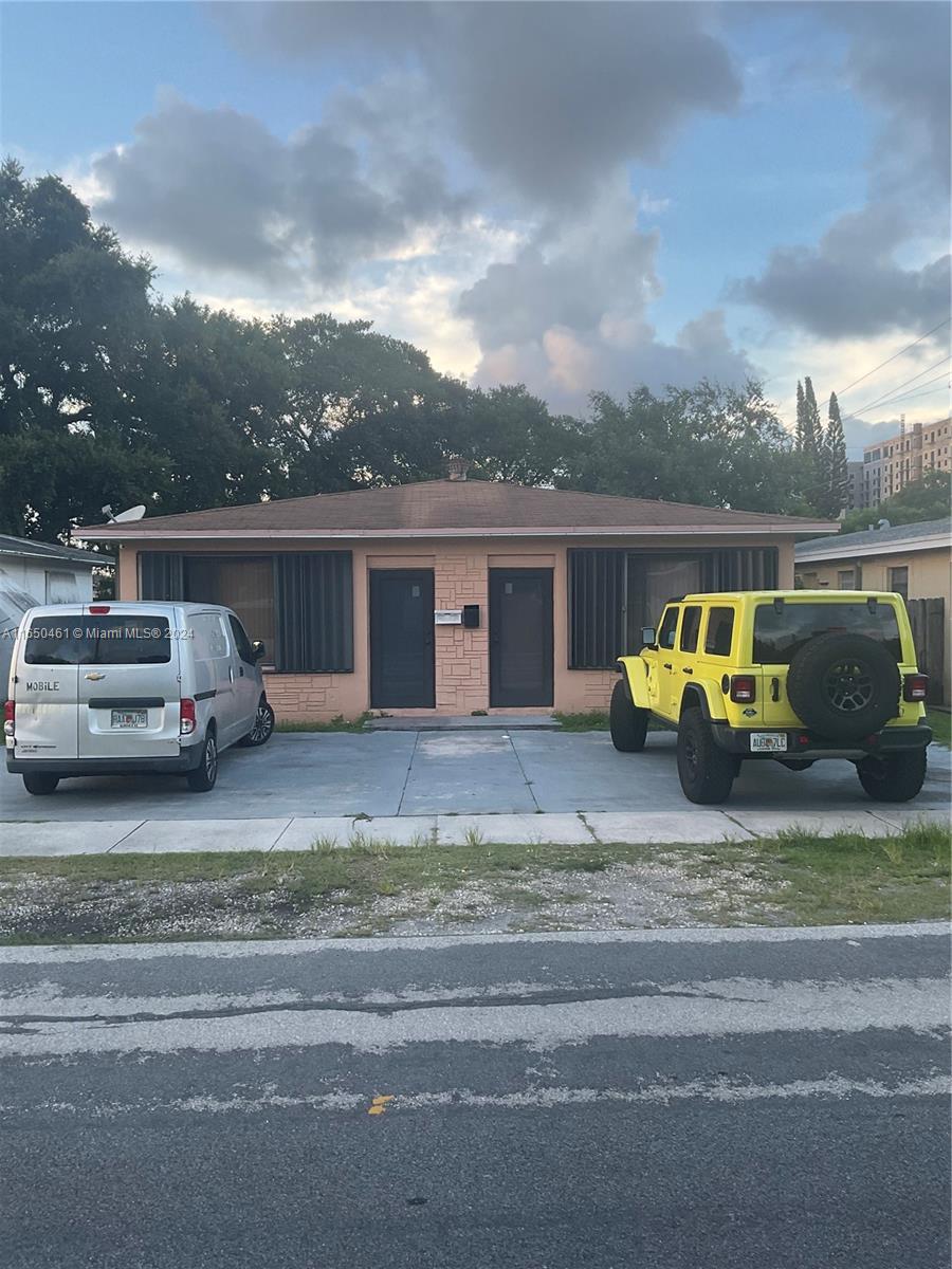 a car parked in front of a house