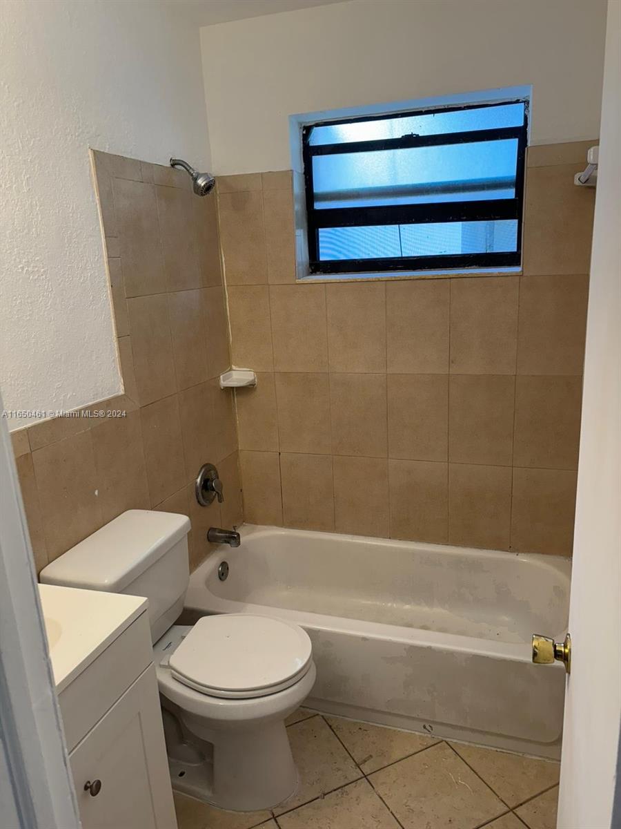 204 Southwest 2nd Place, Unit 2 Dania Beach, FL 33004 - Photo 12 of 13 a bathroom with a toilet and a bathtub
