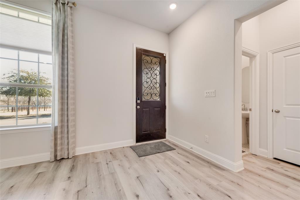 7617 Sunset Boulevard Rowlett, TX 75088 - Photo 5 of 21 Entryway with plenty of natural light, light wood-type flooring, and recessed lighting