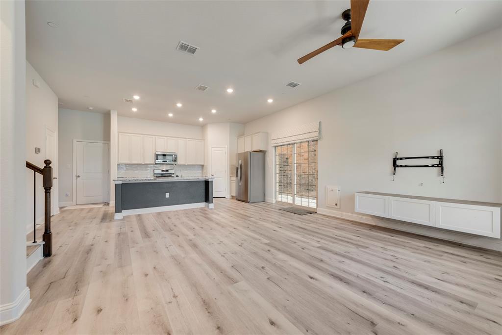 7617 Sunset Boulevard Rowlett, TX 75088 - Photo 7 of 21 Unfurnished living room with recessed lighting, light wood finished floors, stairway, and a ceiling fan