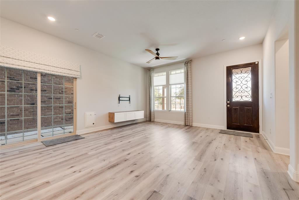 7617 Sunset Boulevard Rowlett, TX 75088 - Photo 8 of 21 Unfurnished living room with light wood-type flooring, ceiling fan, and recessed lighting