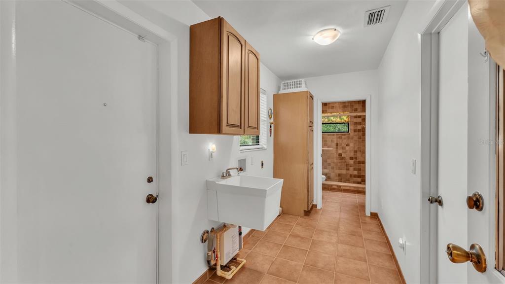 9240 Moore Road Lakeland, FL 33809 - Photo 22 of 61 a bathroom with a sink and a mirror