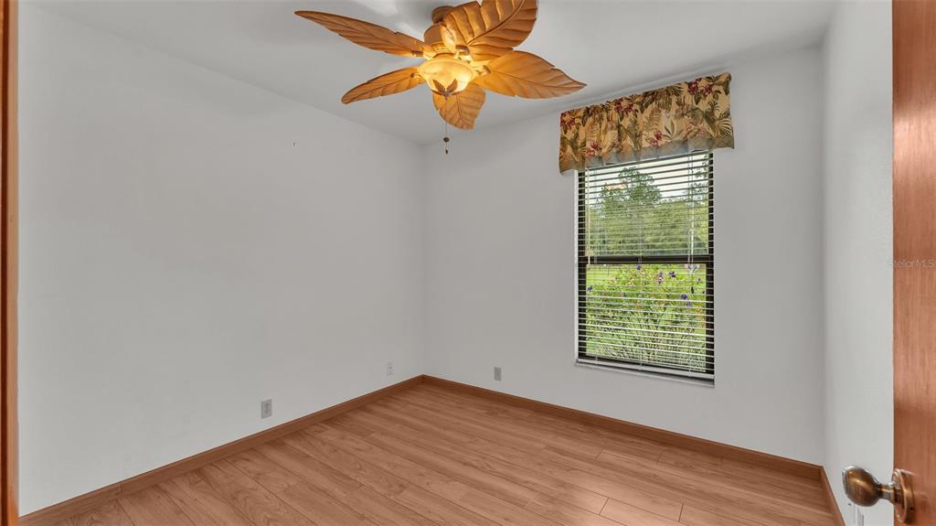 9240 Moore Road Lakeland, FL 33809 - Photo 28 of 61 a view of an empty room with chandelier fan and a window
