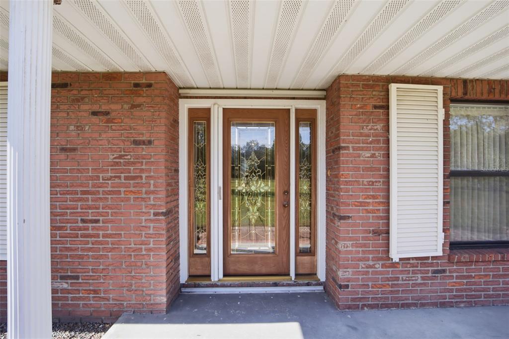 9240 Moore Road Lakeland, FL 33809 - Photo 40 of 61 a view of front door of house with stairs