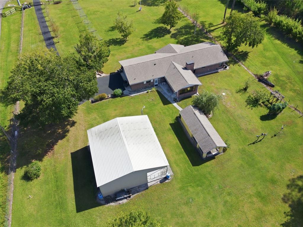 9240 Moore Road Lakeland, FL 33809 - Photo 43 of 61 an aerial view of residential house with outdoor space and swimming pool