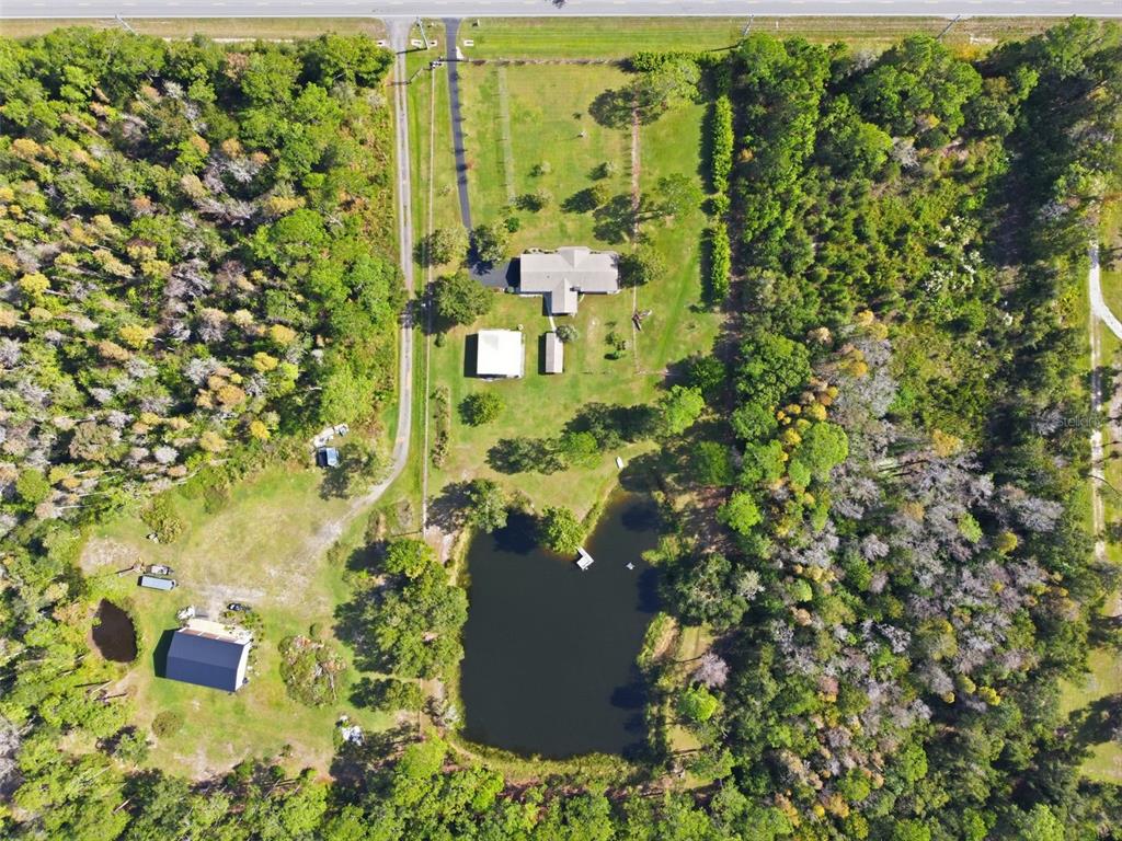 9240 Moore Road Lakeland, FL 33809 - Photo 50 of 61 an aerial view of residential house with parking space