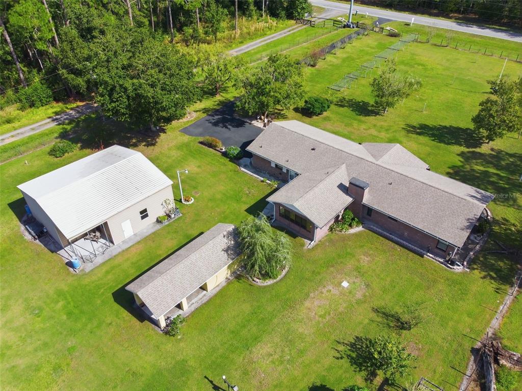 9240 Moore Road Lakeland, FL 33809 - Photo 5 of 61 an aerial view of a house with garden space and street view