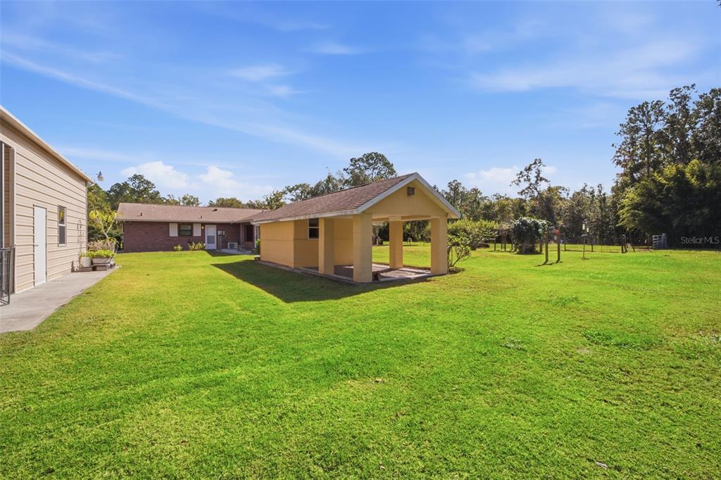 9240 Moore Road Lakeland, FL 33809 - Photo 56 of 61 a view of a house with a big yard
