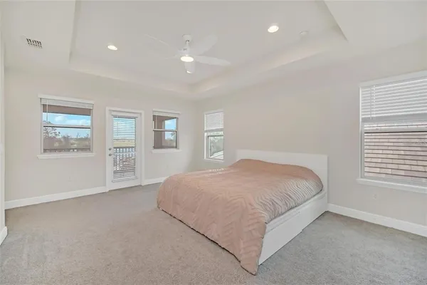 a spacious bedroom with a large bed and a window