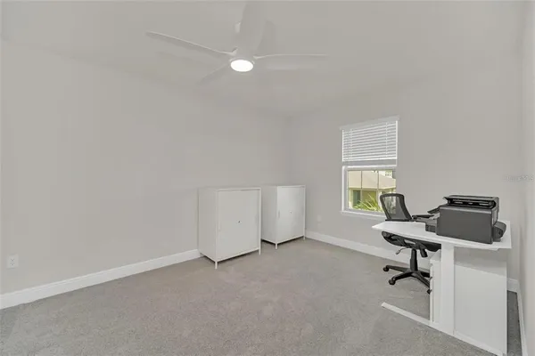 a room with a window and gym equipment