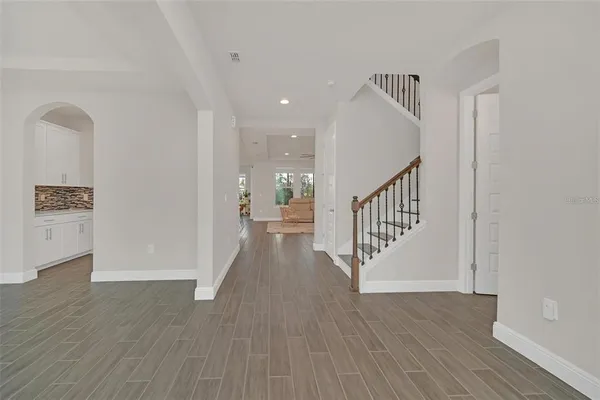 a view of entryway with wooden floor