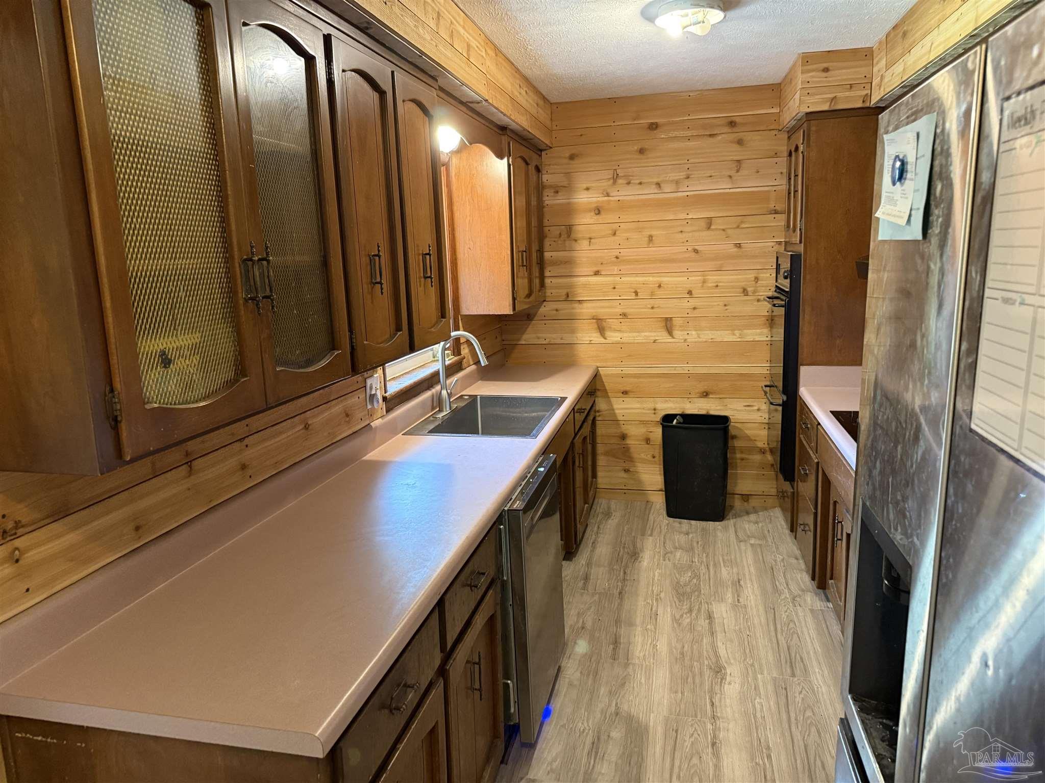 5031 Molino Road Molino, FL 32577 - Photo 11 of 37 a bathroom with a sink a mirror and a shower