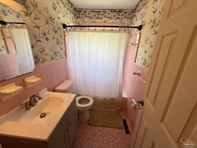 a bedroom with bed and window